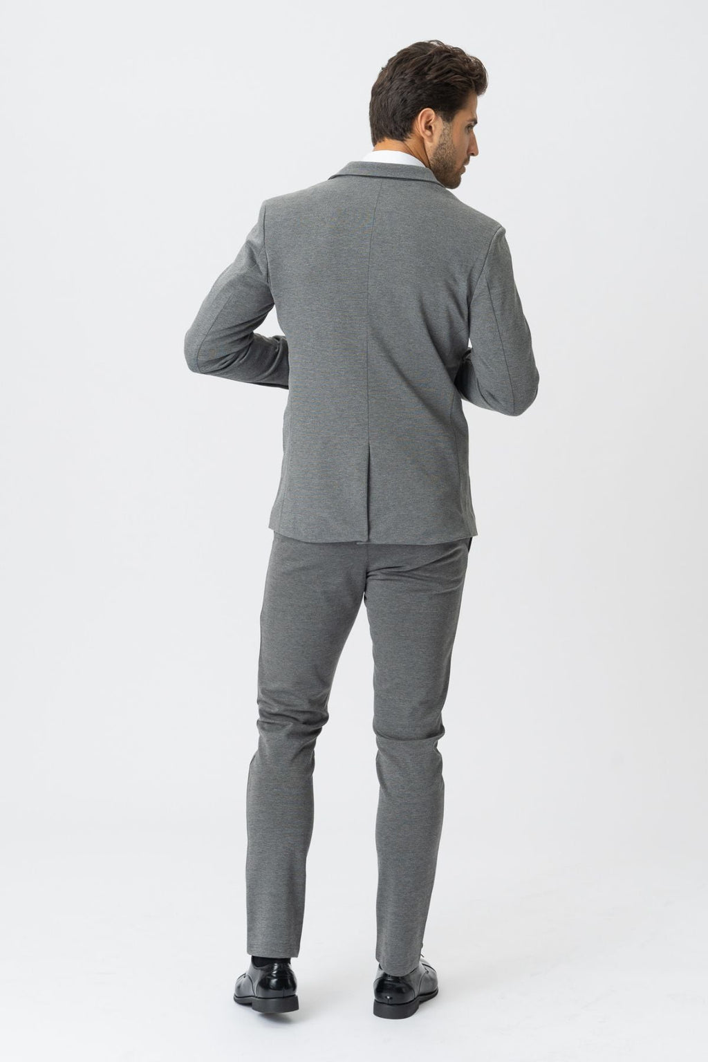 The Original Performance Suit™️ (Tummanharmaa) - Pakkauskauppa