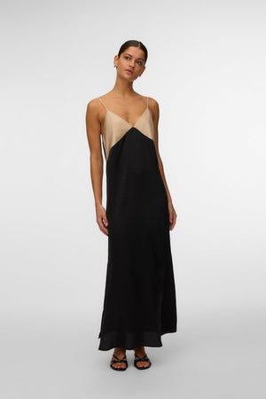 Joy Singlet Nilkkamekko - Sementtimusta kontrasti